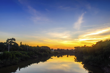 Fototapeta na wymiar Colorful sunset at the river