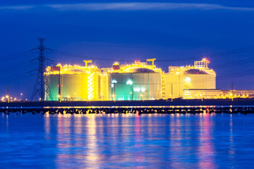 petrochemical industrial oil tanks in a refinery at twilight