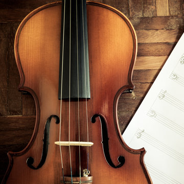 classical violin and blank music sheet on wooden floor for composer concept background