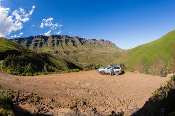 Mountains Vehicle Woman explores rugged scenic mountains valley terrain.