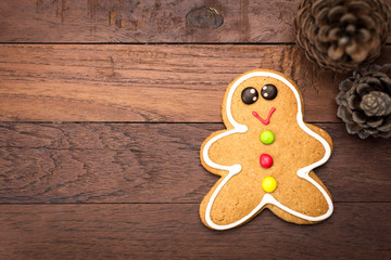 Christmas homemade gingerbread cookies over wooden background
