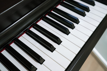 black Piano and Piano keyboard.
Close up shot of grand piano Keys - The New Polished Piano keyboard

