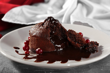 Chocolate fondant with berries on plate