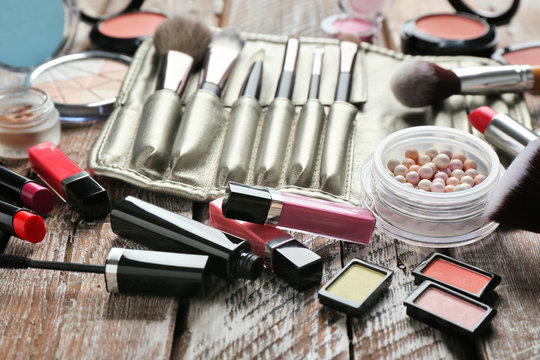 Set of decorative cosmetics on wooden table