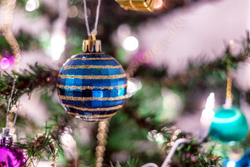 Fototapeta premium Christmas decorations on a green Christmas tree. Festive Christm