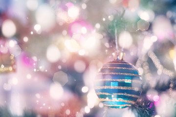 Fototapeta premium Christmas decorations on a green Christmas tree. Festive Christm