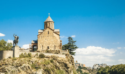 Fototapeta na wymiar Metekhi Church and Monument of King Vakhtang I Gorgasali in Tbilisi
