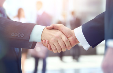 Concept of partnership - handshake  business partners