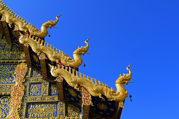 Fototapeta na wymiar The right roof of Wat Rong Sua Ten at Chiang Rai, Thailand - Buddhist Temple 