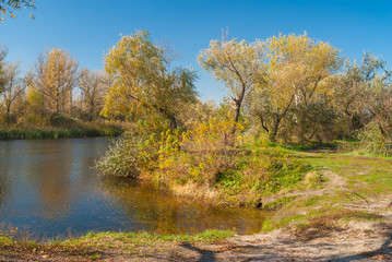 Fototapeta na wymiar Riverside of small Ukrainian river Oril (left inflow of biggest river Dnepr) at fall season