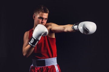 Young boxer sportsman in red sport suit