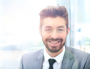 Fototapeta premium portrait of happy smiling business man, isolated on white background