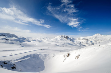 Fototapeta na wymiar Alpine winter mountain landscape. French Alps with snow.