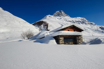 Alpine winter mountain landscape. French Alps with snow.