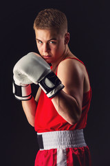 Young boxer sportsman in red sport suit