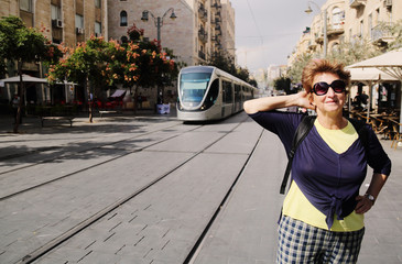 Portrait of cheerful senior woman enjoying the trip