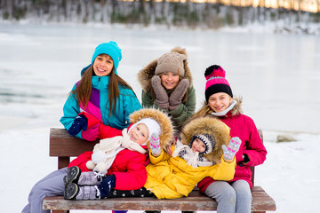 Group of young girls sitting at the bench