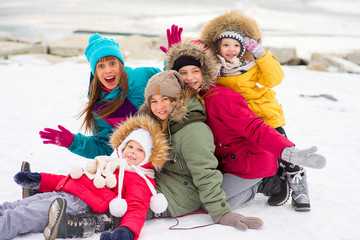 Fototapeta na wymiar Group of young girls on the frozen lake