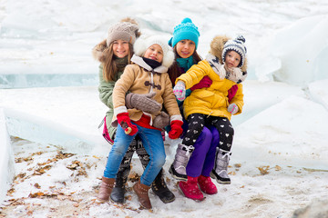 Group of young girls sitting at the ice block