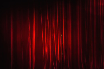 Red curtain and a lonely microphone