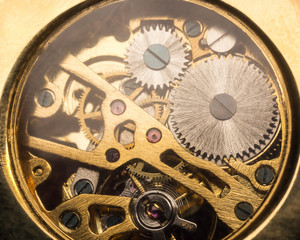 Close up macro shot of golden clock mechanism