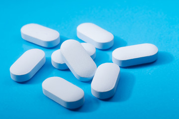 Macro shot of blue drugs on blue background