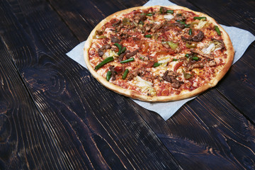Homemade pizza on a wooden table