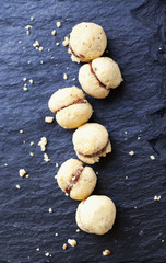 Baci di dama over black stone