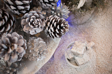 Pine cone decoration for winter season, Christmas with snow on table.
