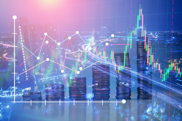 Double explosure with businesss charts and financial district of