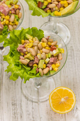homemade fresh organic salad with white beans and avocado