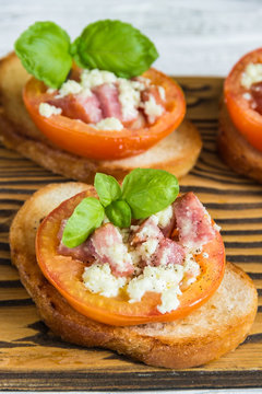 tomatoes stuffed with Basil cheese on toast