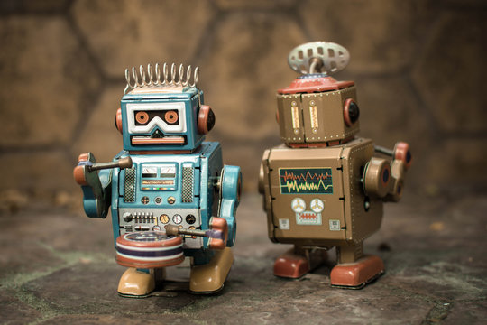 Old robot toy, vintage color style, vintage tone background.