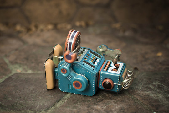 Retro robot toy, vintage color style, vintage tone background.