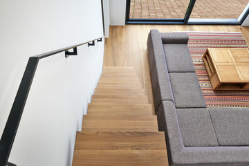 Hardwood stairs and ramp in modern living room