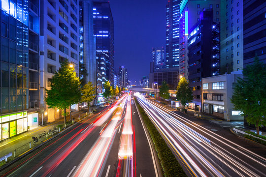 Cityscape of Shinjuku district with traffic lights on the street of Tokyo, Japan