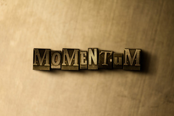 Naklejka premium MOMENTUM - close-up of grungy vintage typeset word on metal backdrop. Royalty free stock - 3D rendered stock image. Can be used for online banner ads and direct mail.