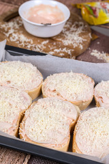 Sandwiches with ham and grated cheese
