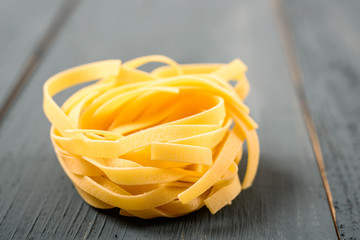Italian Tagliatelle Pasta On Wood Table