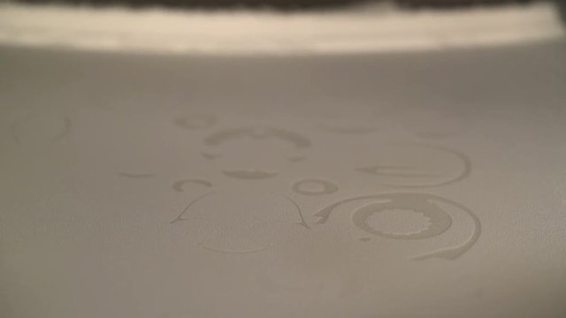 3D Printer during work. Selective laser sintering is an additive manufacturing technique that uses a laser as the power source to sinter powdered material.
