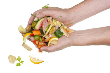 From hands of the cook food waste falls