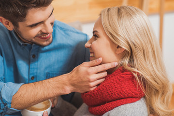 Joyful loving couple relaxing at home