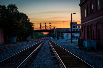 Fototapeta na wymiar Railroad tracks at sunset, in downtown Greensboro, North Carolin