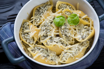 Casserole with italian conchiglioni pasta, close-up, studio shot