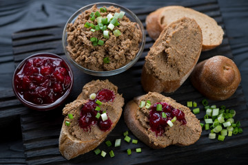 Obraz na płótnie Canvas Appetizers with chicken liver pate and cranberry sauce