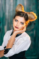 Obraz premium Stylish young woman in black pants, white shirt. portrait of a business lady.