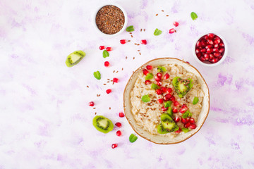 Tasty and healthy oatmeal porridge with fruit, berry and flax seeds. Healthy breakfast. Fitness food. Proper nutrition. Breakfast on Valentine's Day. Top view. Flat lay