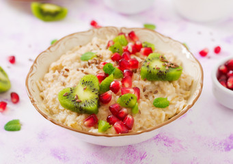 Tasty and healthy oatmeal porridge with fruit, berry and flax seeds. Healthy breakfast. Fitness food. Proper nutrition. Breakfast on Valentine's Day.