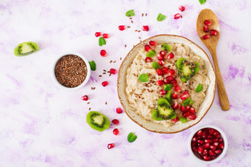 Tasty and healthy oatmeal porridge with fruit, berry and flax seeds. Healthy breakfast. Fitness food. Proper nutrition. Breakfast on Valentine's Day. Top view. Flat lay