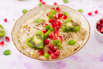 Tasty and healthy oatmeal porridge with fruit, berry and flax seeds. Healthy breakfast. Fitness food. Proper nutrition. Breakfast on Valentine's Day.